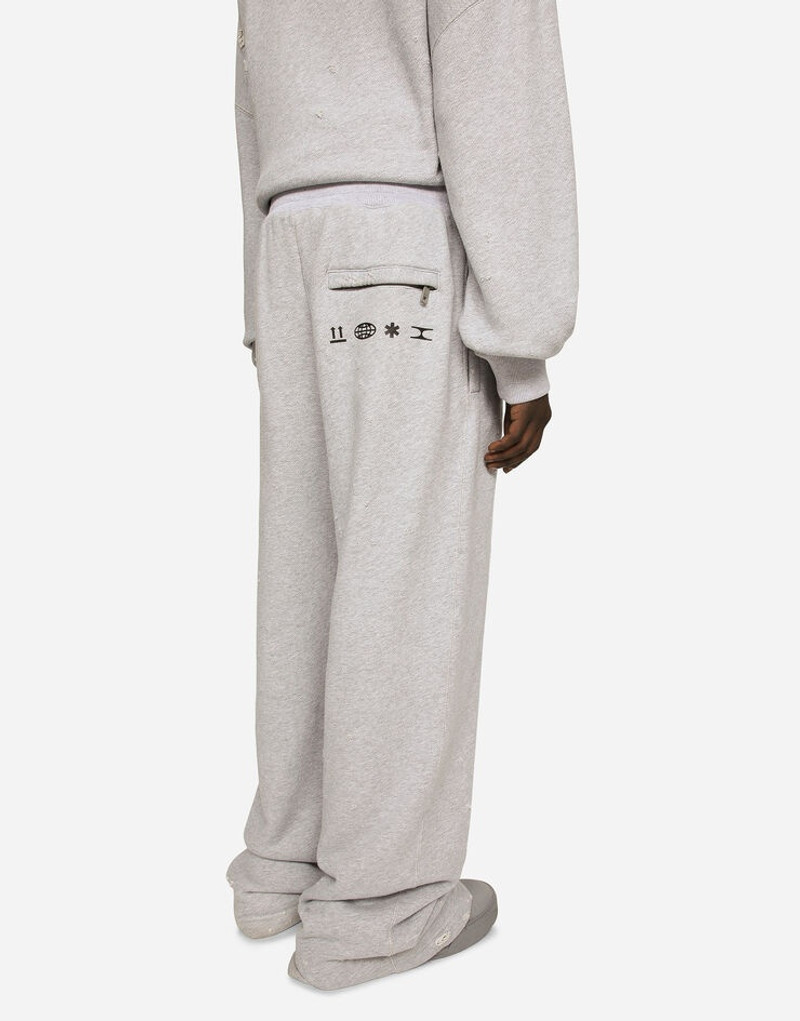 Printed jogging pants with small abrasions 5