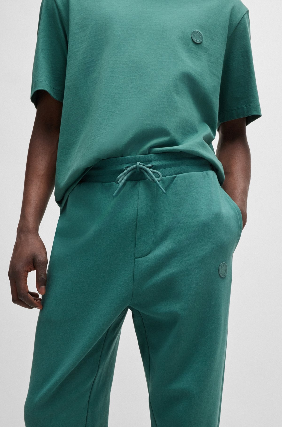 COTTON-TERRY TRACKSUIT BOTTOMS WITH HAPPY HUGO LOGO PATCH - 3