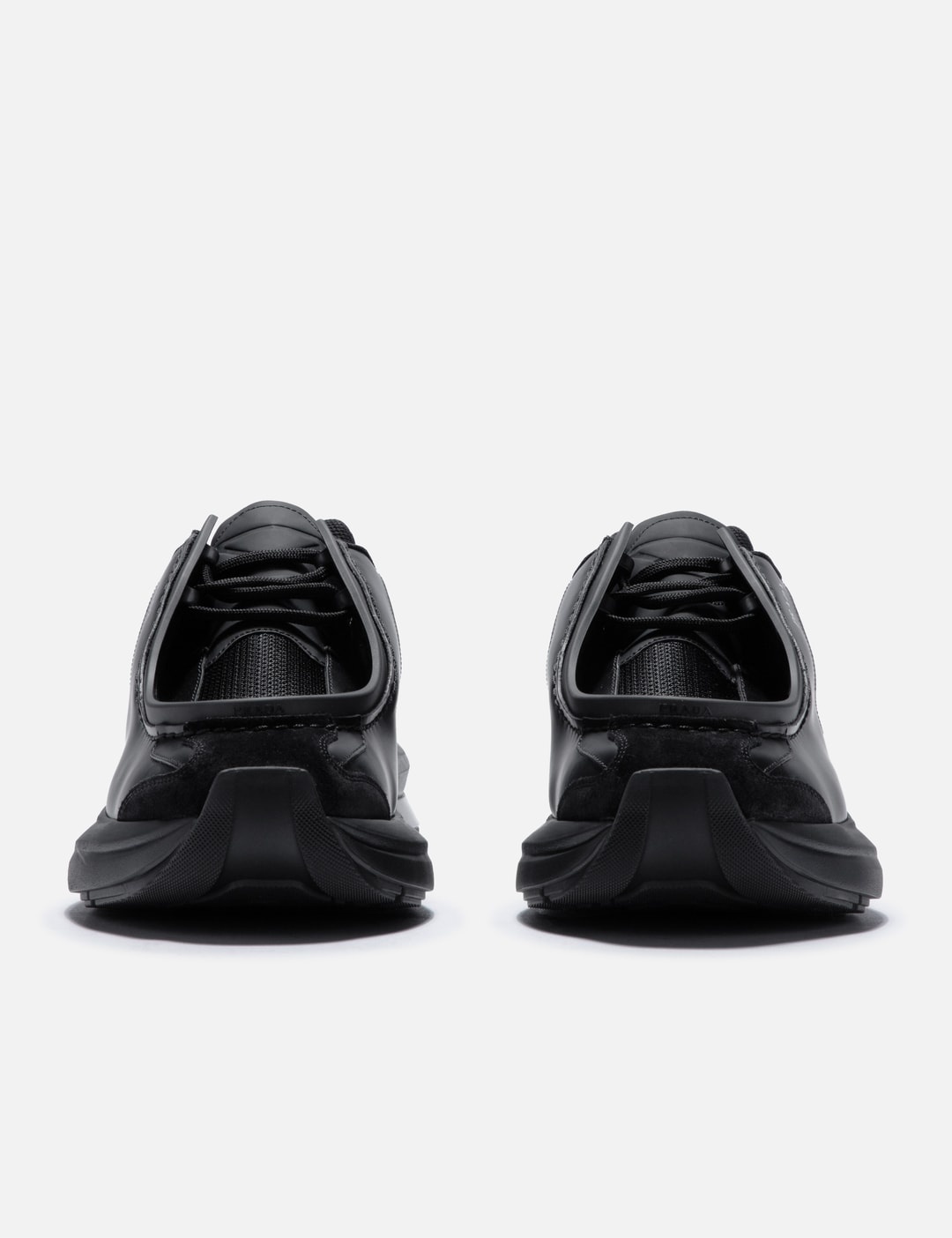 Prada SYSTEME BRUSHED LEATHER SNEAKERS | hbx | REVERSIBLE