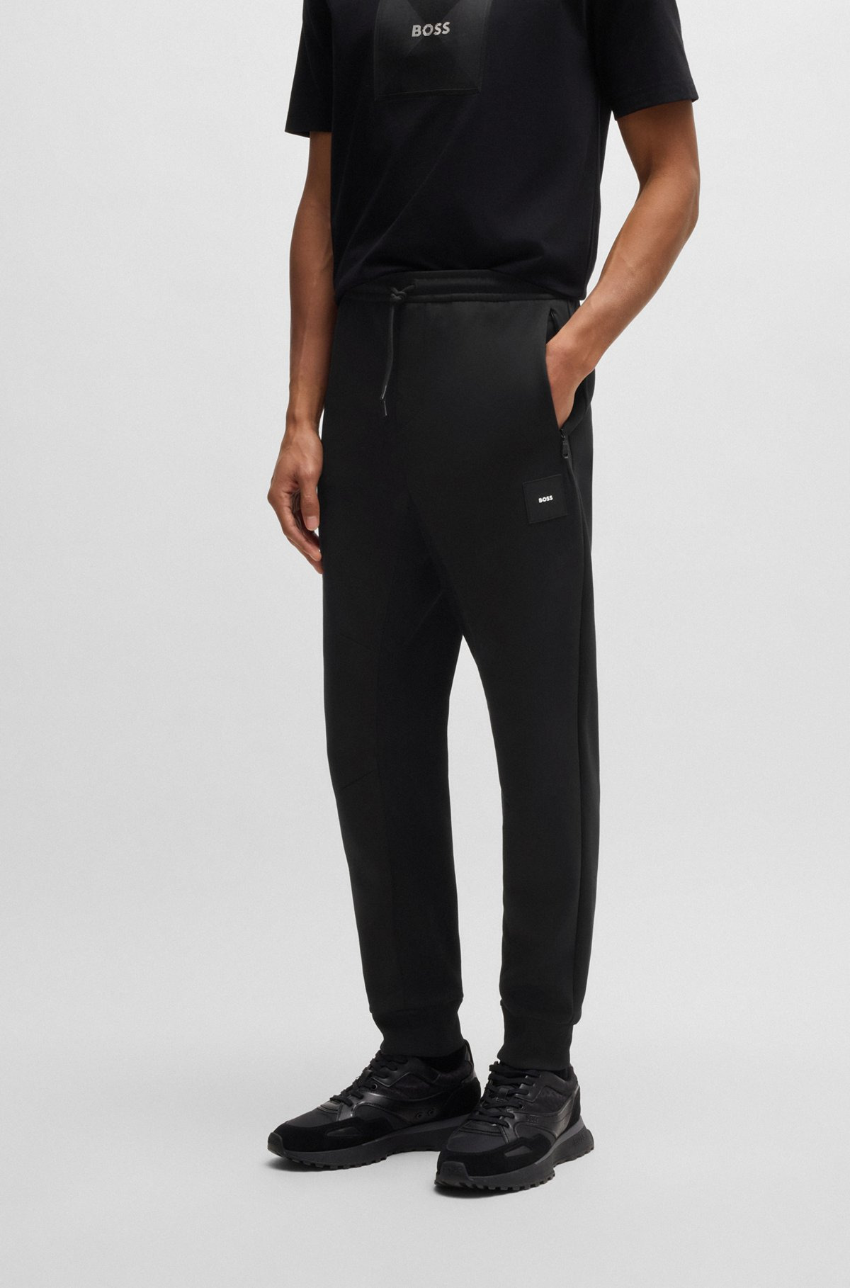 STRETCH TRACKSUIT BOTTOMS WITH LOGO PATCH - 2