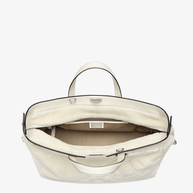 Peekaboo ISeeU Forty8 bag made of soft white sheepskin with an oversized shaved O’Lock motif. Roomy  5