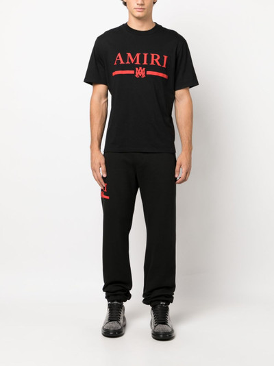 AMIRI logo-print cotton track pants outlook