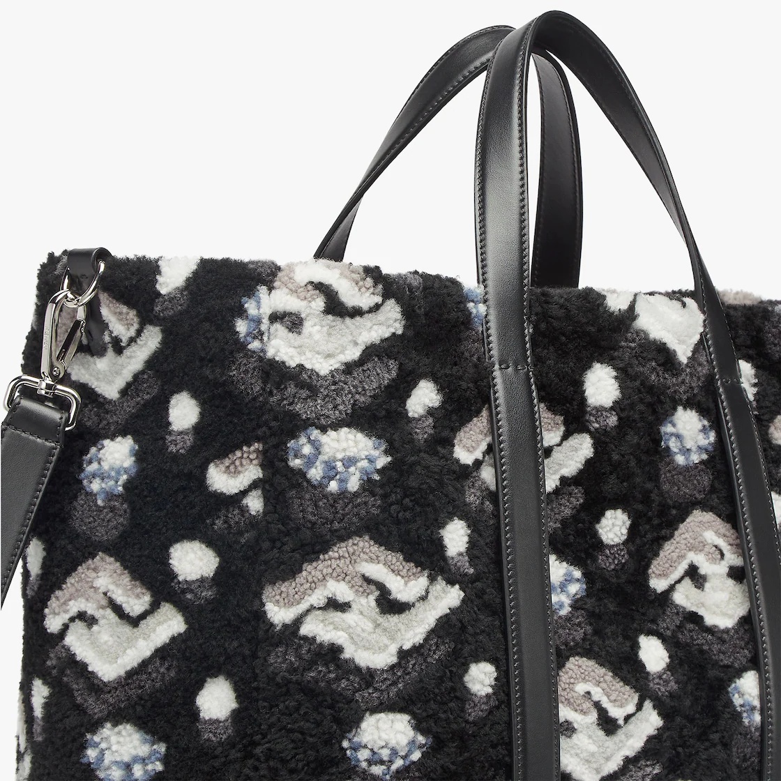 Roomy shopper made of soft curly sheepskin with FF inlay in black, gray and white. Features a fabric - 5