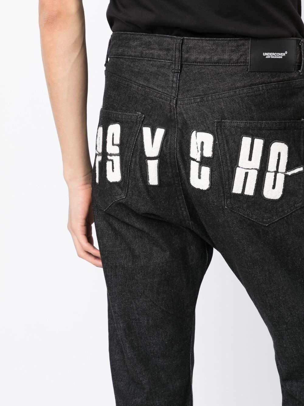 x Psycho logo-appliqué jeans - 5