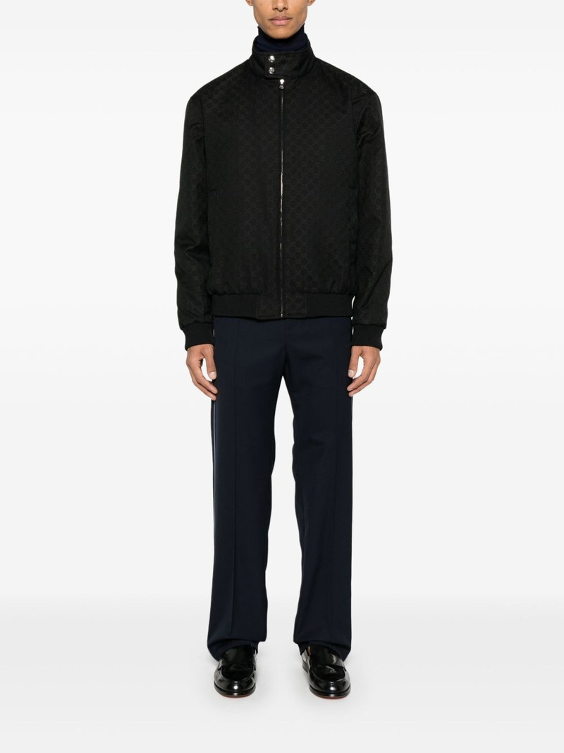GUCCI logo-patch trousers outlook