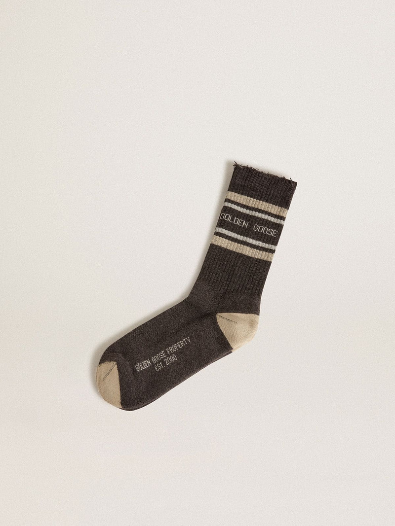 Dark grey socks with distressed details and cream and worn-white stripes 1
