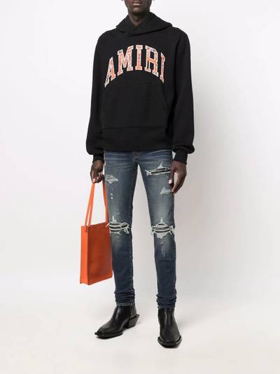 AMIRI distressed skinny fit jeans outlook