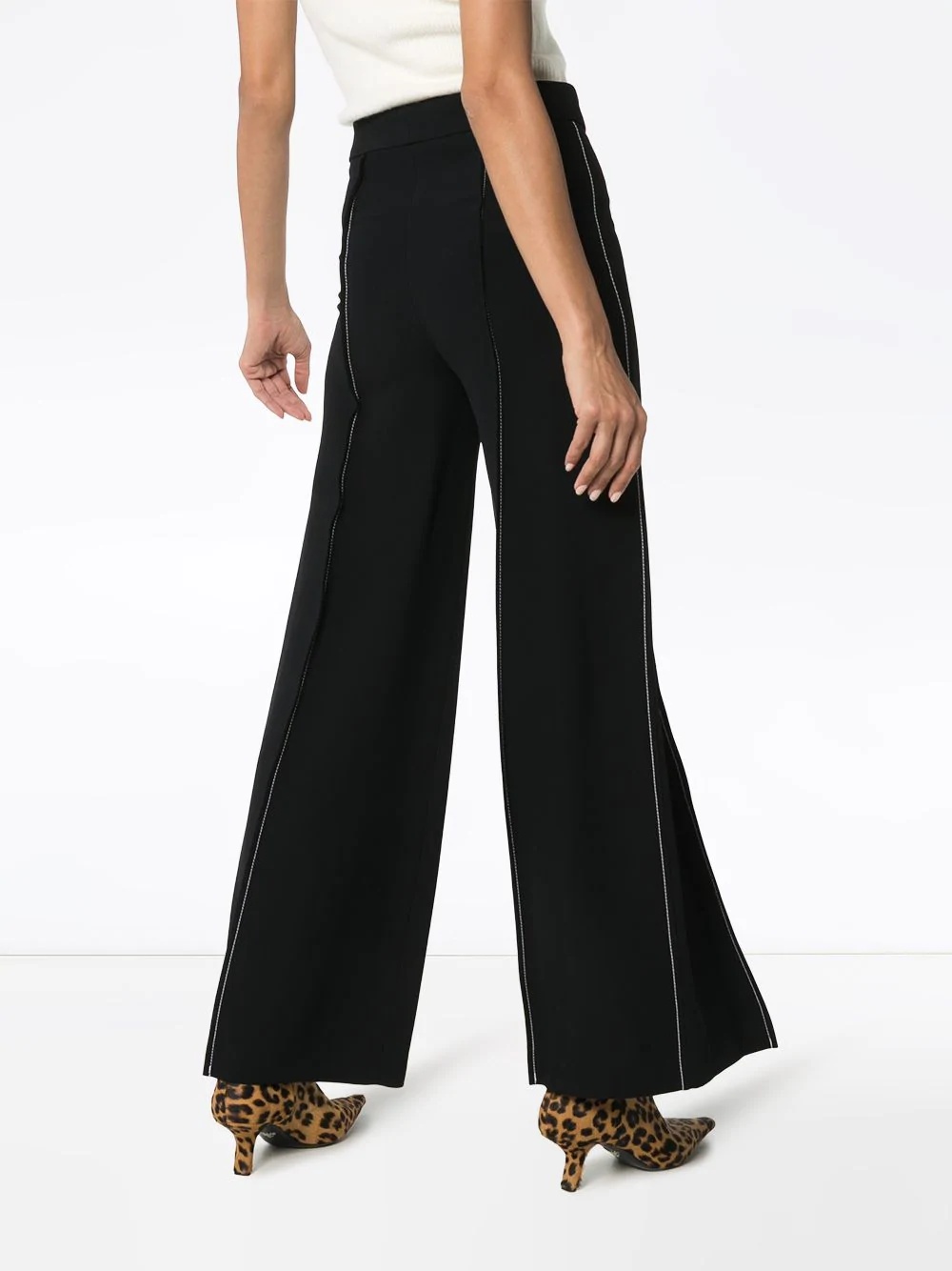 contrast-stitch flared trousers - 4