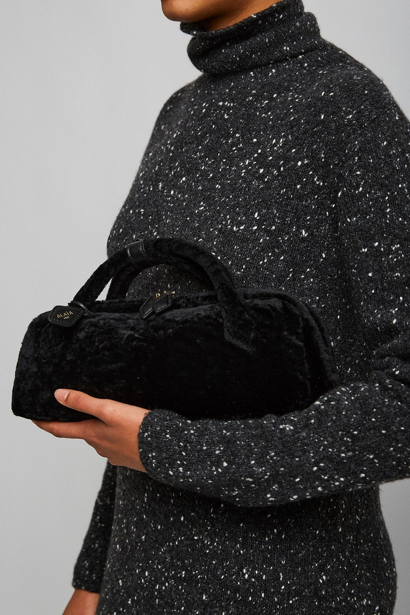 Alaïa Le Teckel black shearling clutch outlook