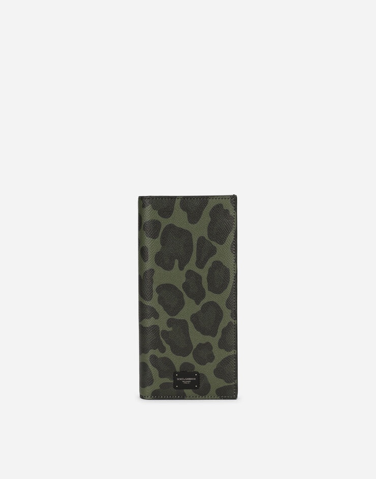 Dauphine calfskin vertical wallet with leopard print against a green background - 1