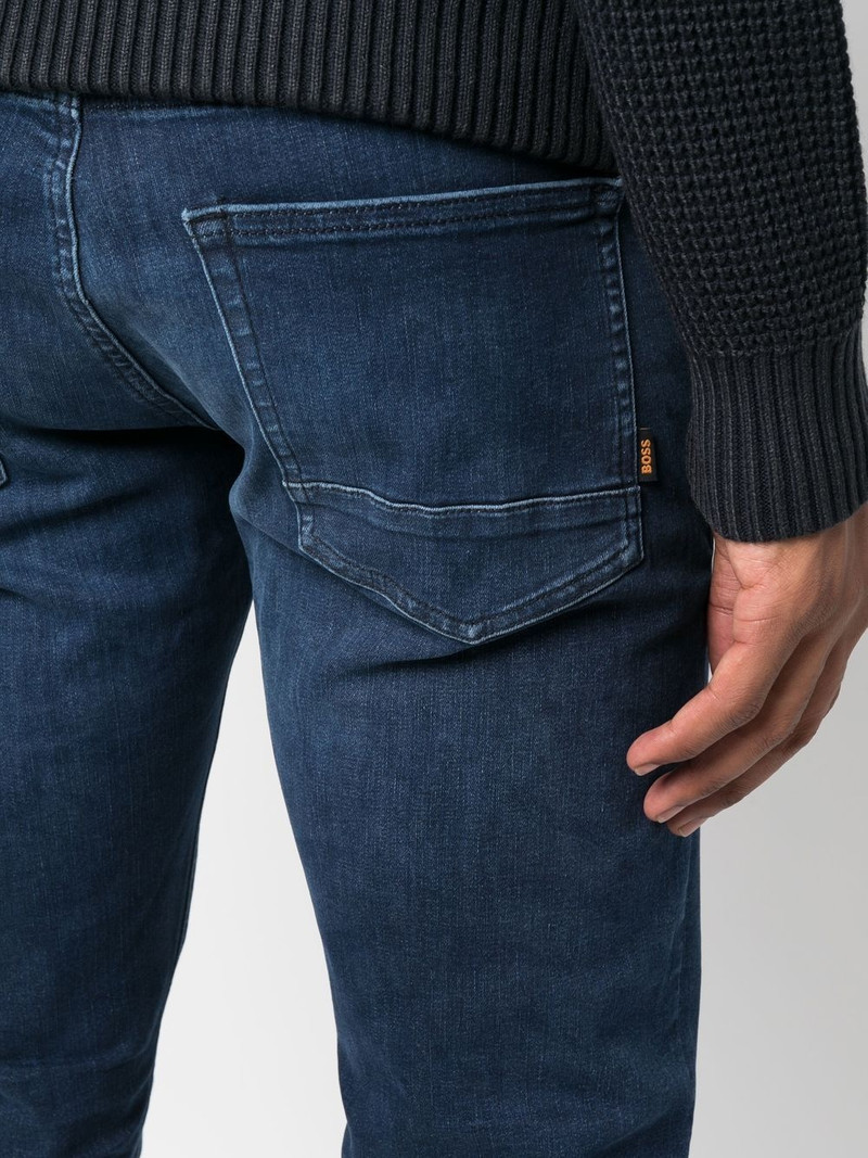 mid-wash logo-patch jeans 5