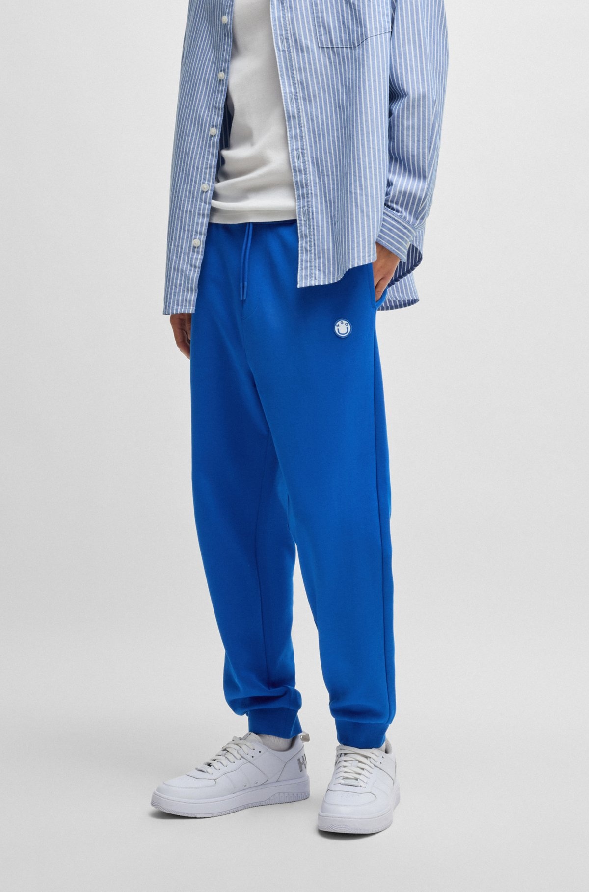 COTTON-TERRY TRACKSUIT BOTTOMS WITH HAPPY HUGO LOGO PATCH - 2