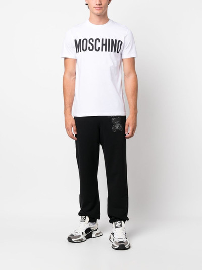 Moschino logo-print organic cotton track pants outlook