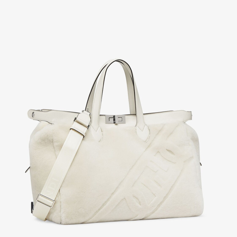 Peekaboo ISeeU Forty8 bag made of soft white sheepskin with an oversized shaved O’Lock motif. Roomy  3