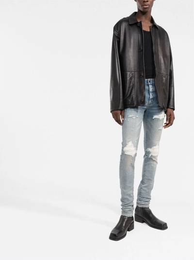 AMIRI distressed skinny jeans outlook