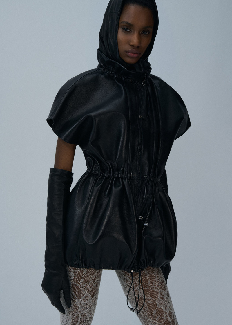 Elasticized leather peplum jacket in black 4