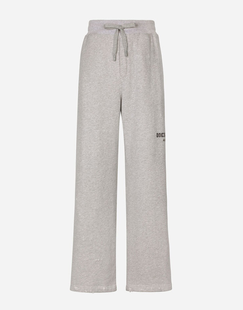 Printed jogging pants with small abrasions 1