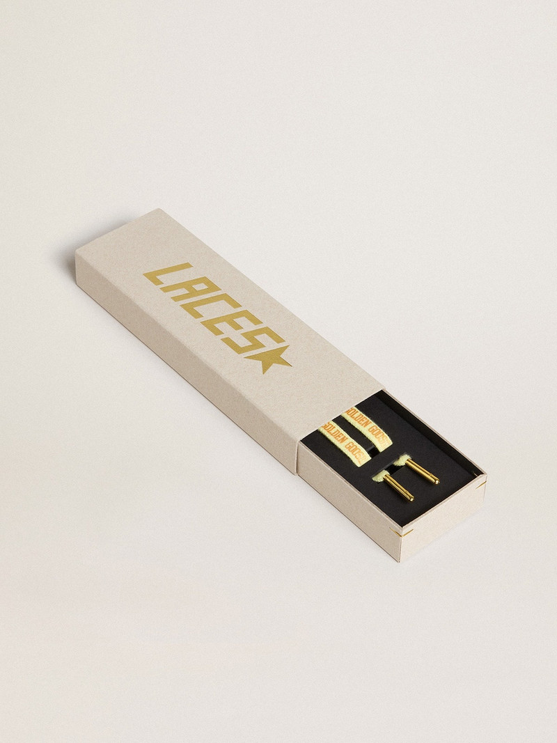 Yellow cotton laces with contrasting gold-colored logo - 1