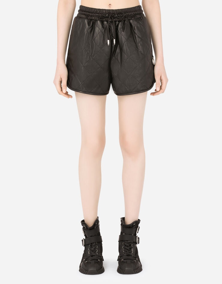 Quilted leather shorts with DG pendant - 1