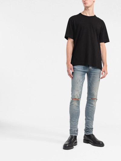 AMIRI distressed slim-fit jeans outlook