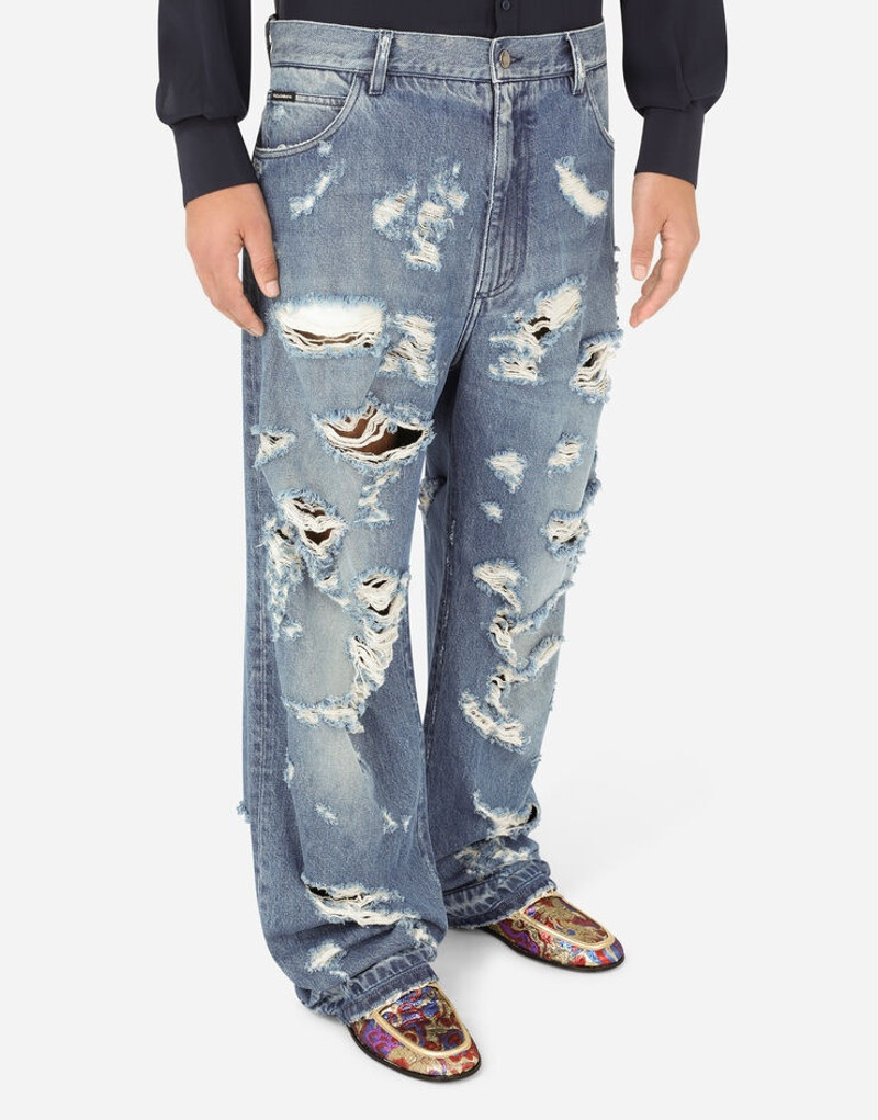 Oversize light blue wash jeans with rips 4