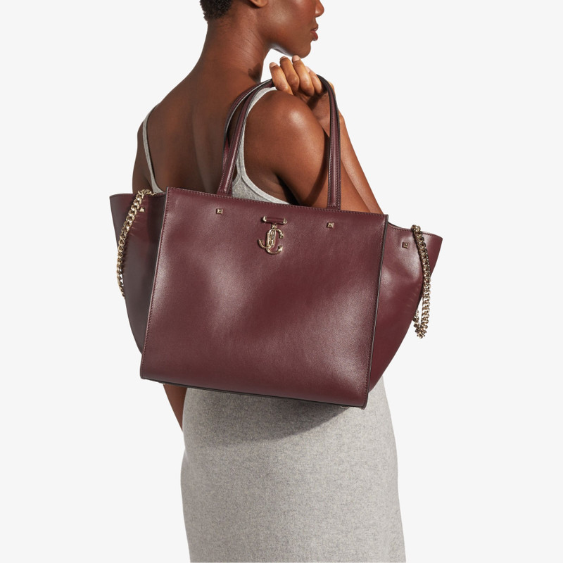 JIMMY CHOO Varenne Tote Bag
Burgundy Fine Shiny Calf Leather Logo Tote Bag with Light Gold JC Emblem outlook