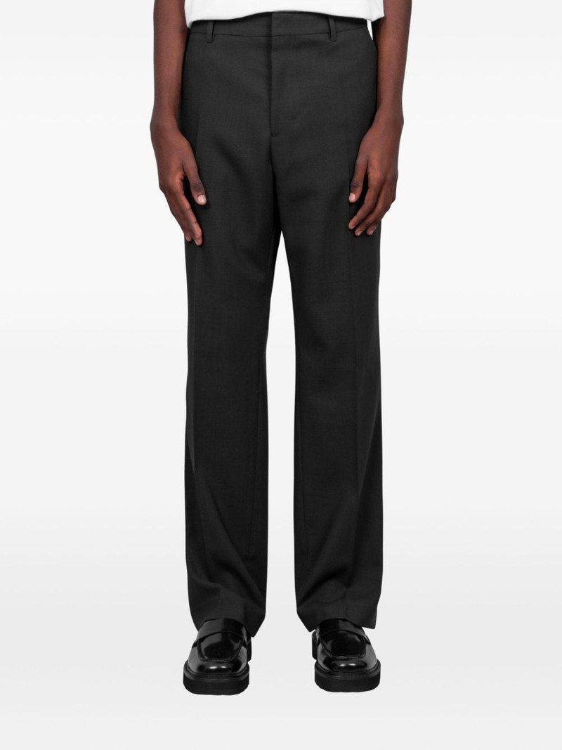 button fastening trousers 1