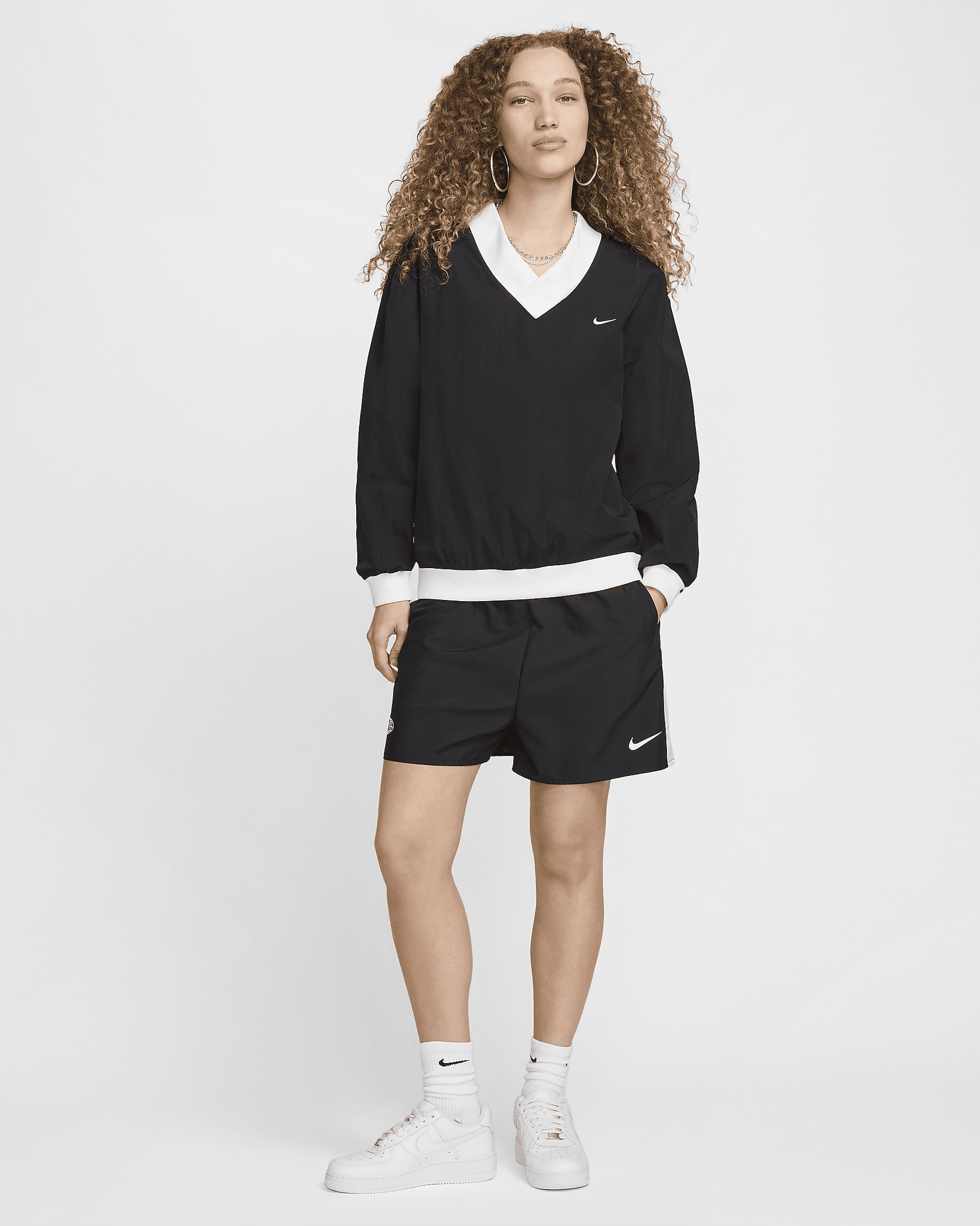 Nike Sportswear Essential Women's Loose UV Woven Long-Sleeve V-Neck Top - 6