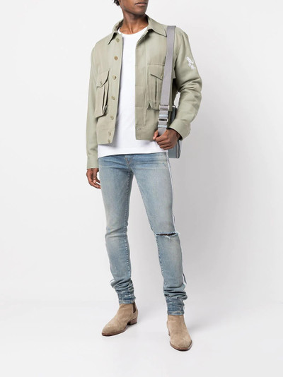 AMIRI distressed-effect side-stripe jeans outlook