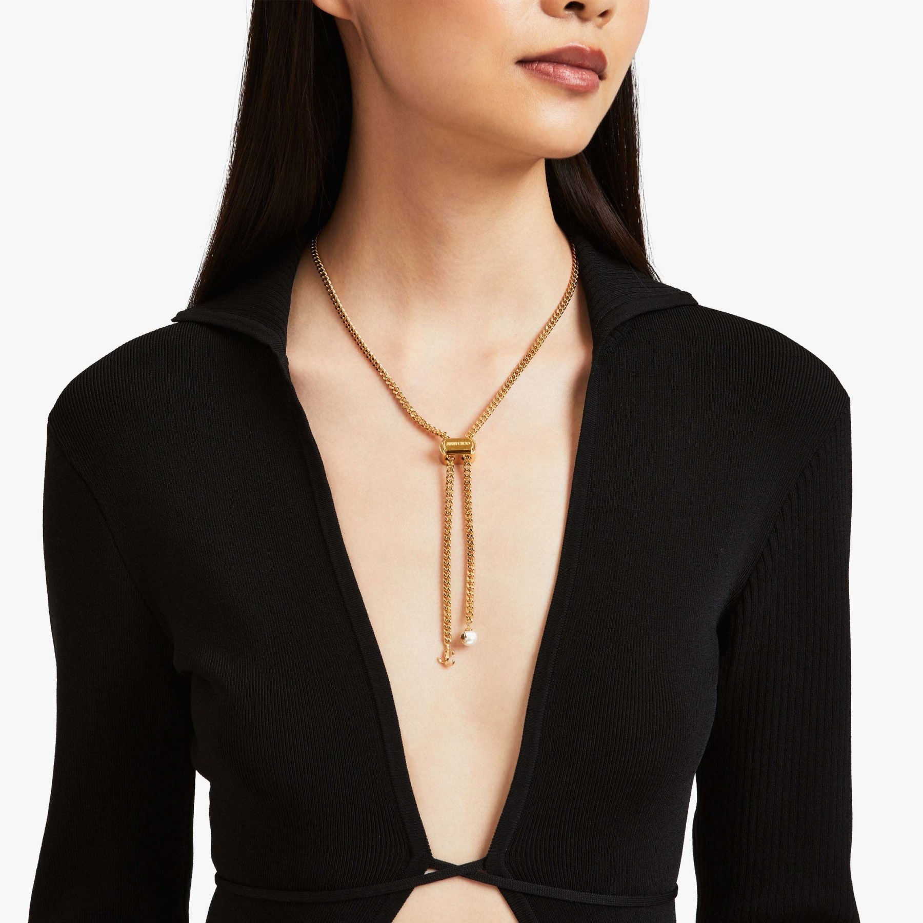Bon Bon Necklace
Gold-Finish Metal Necklace with Pearl and JC Charm - 2