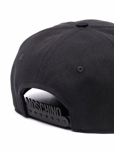 Moschino painted logo-print cap outlook