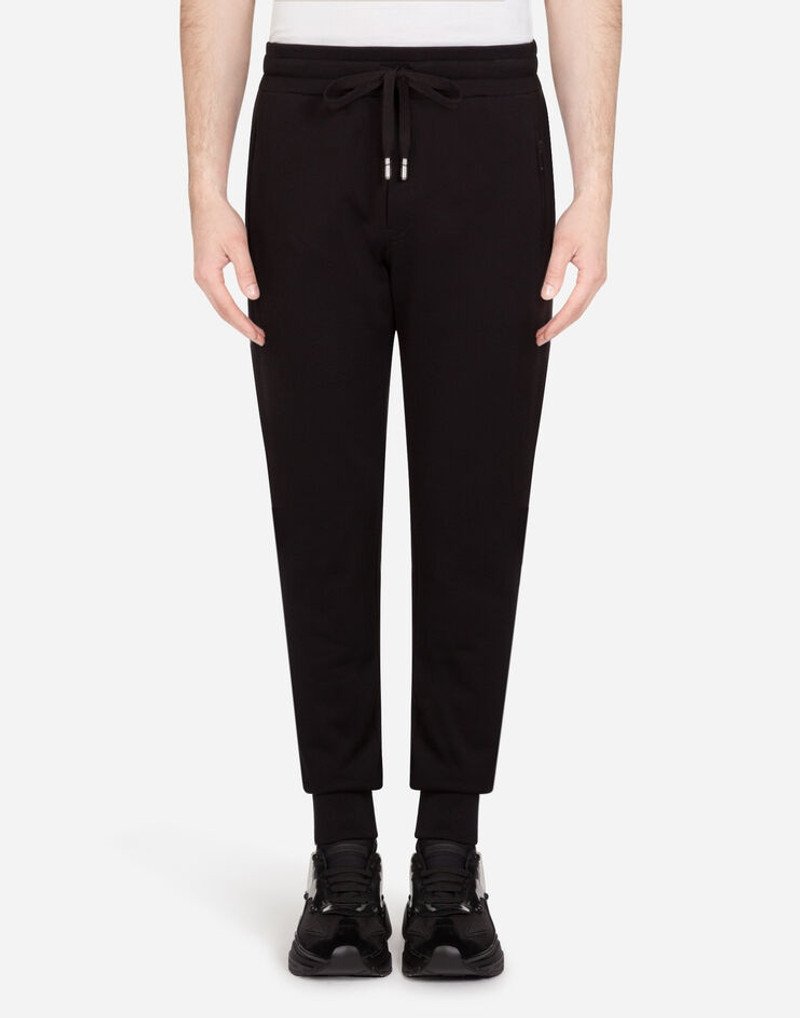 Jogging pants with rubberized logo patch 1