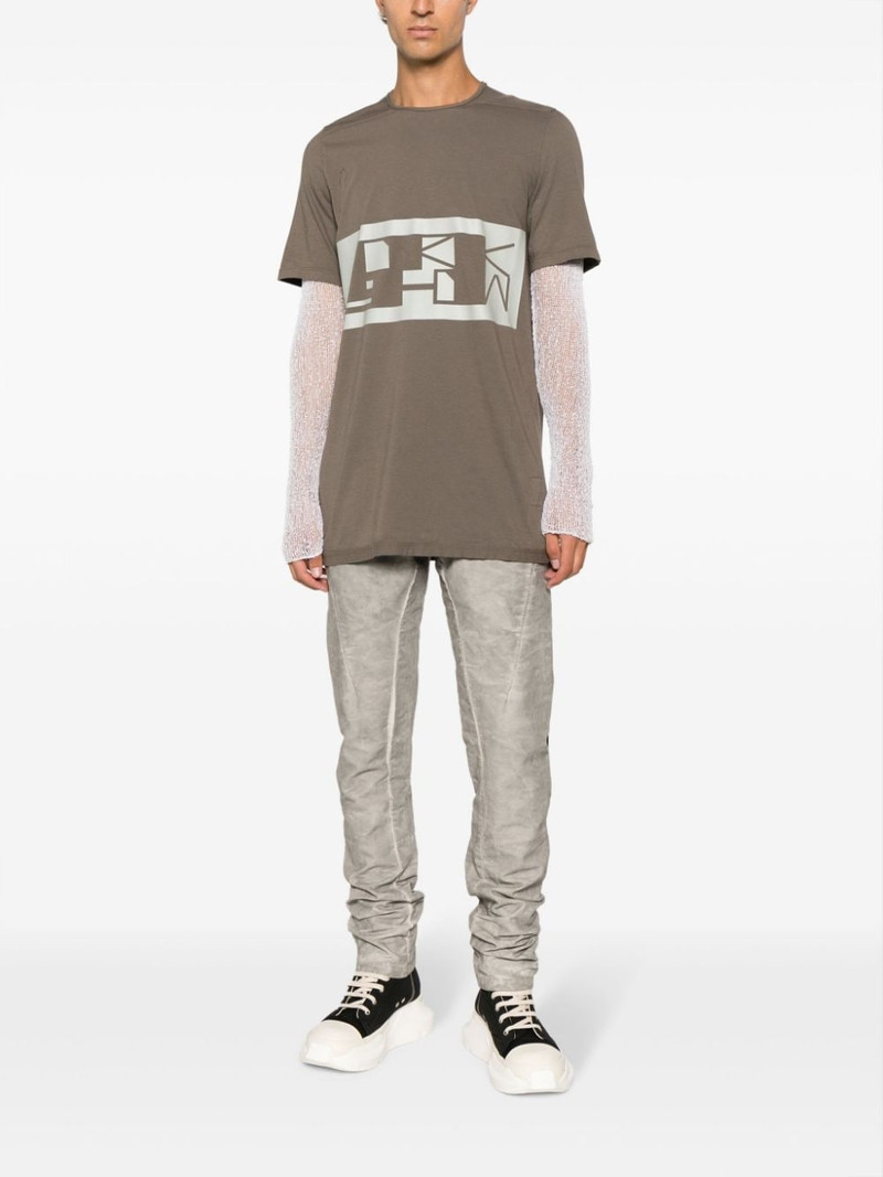Isaac Sellam logo-plaque crease-effect tapered trousers outlook