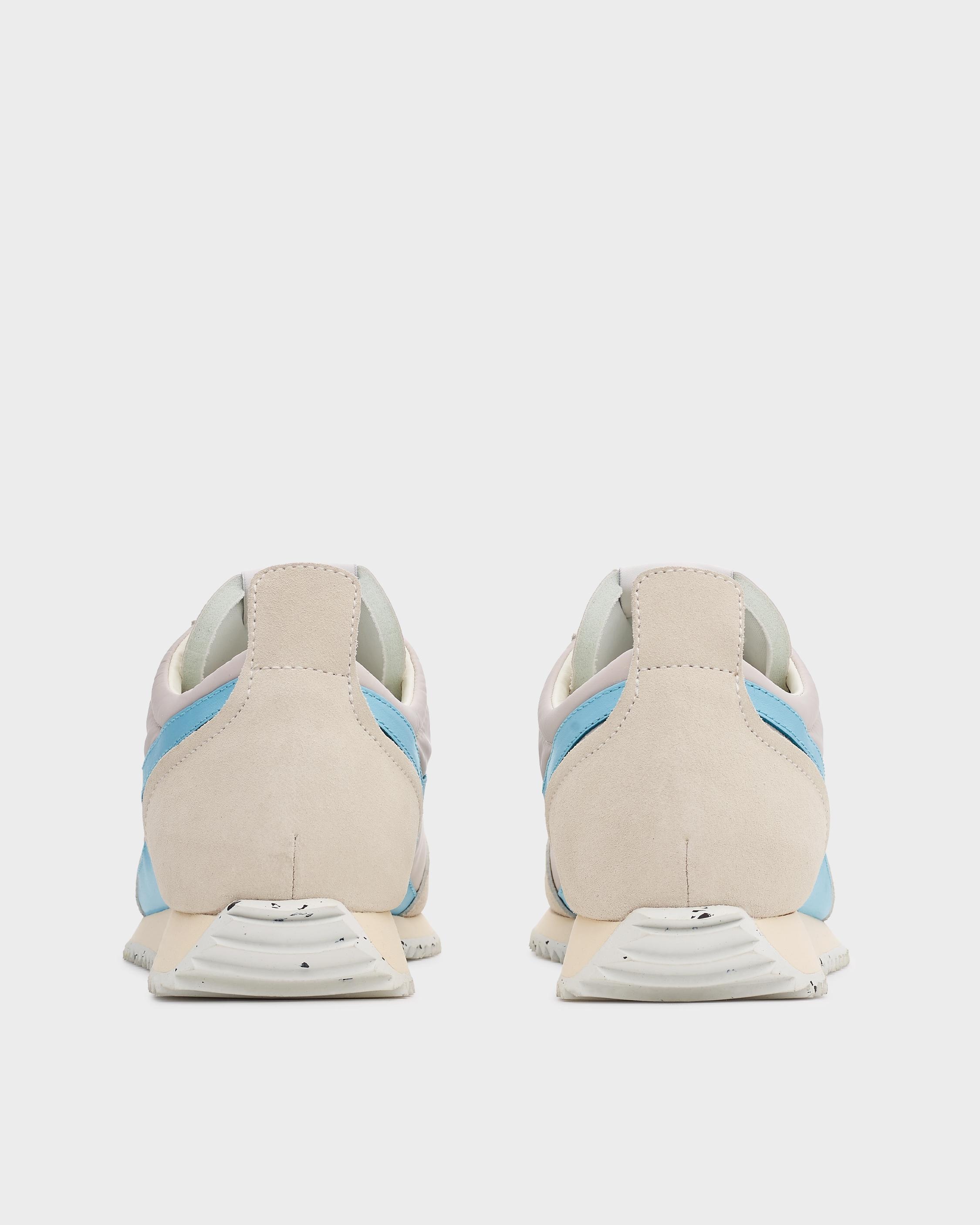 Retro Runner
Leather and Recycled Material Sneaker - 4