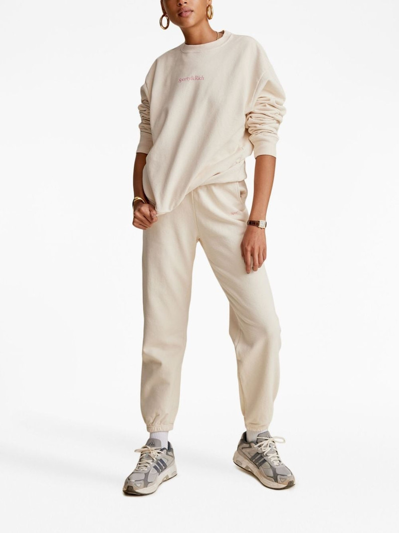 Sporty & Rich Serif logo-print track pants outlook