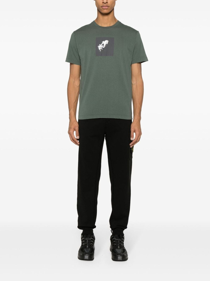 Stone Island Compass-appliqué cotton track pants outlook