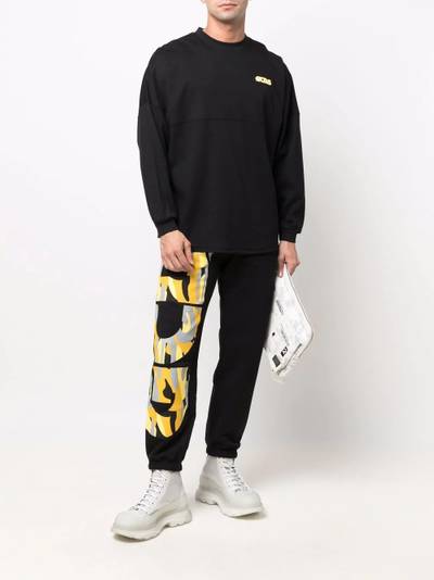 GCDS logo-print track pants outlook