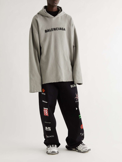 BALENCIAGA Oversized Distressed Logo-Print Cotton-Jersey Hoodie outlook