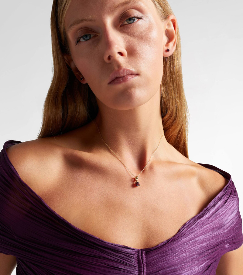 STONE AND STRAND 10kt gold charm necklace with garnet outlook