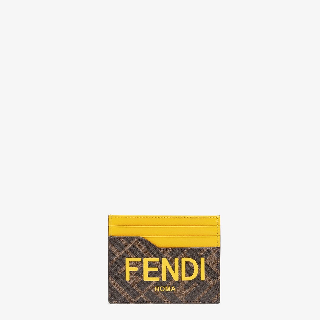 Card holder with central flat pocket and 6 slots. Made of textured fabric with FF motif in brown and 1