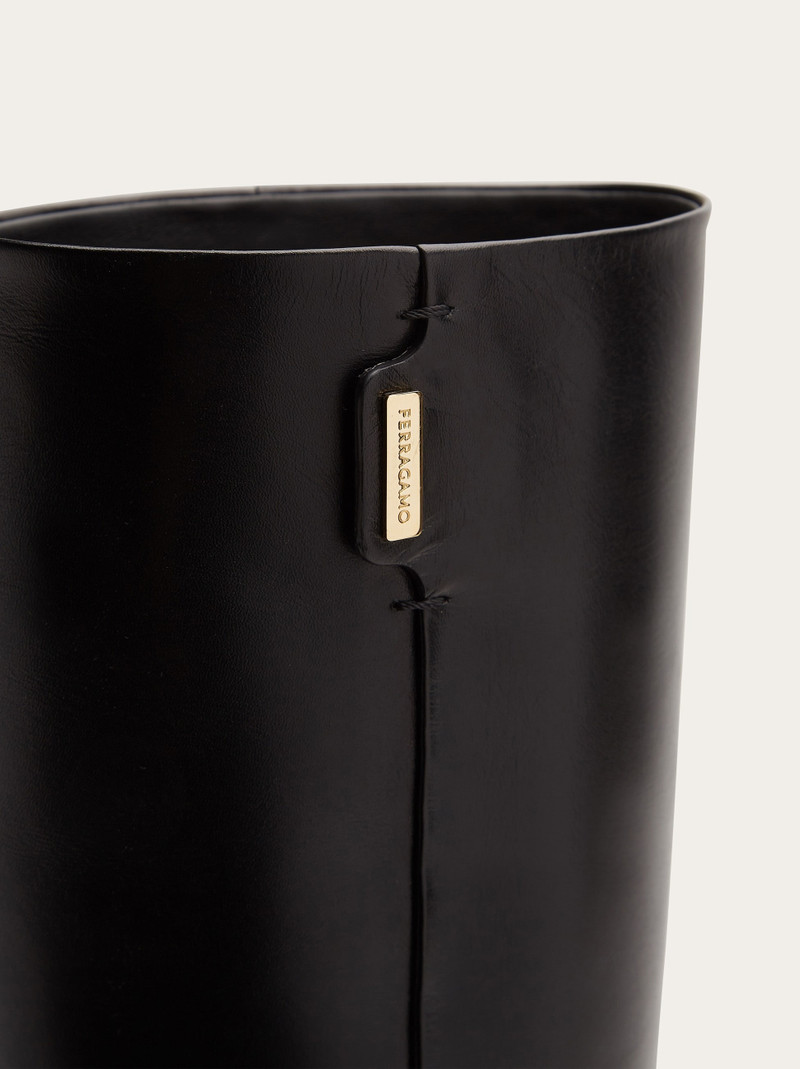Knee high boot with golden tab 7