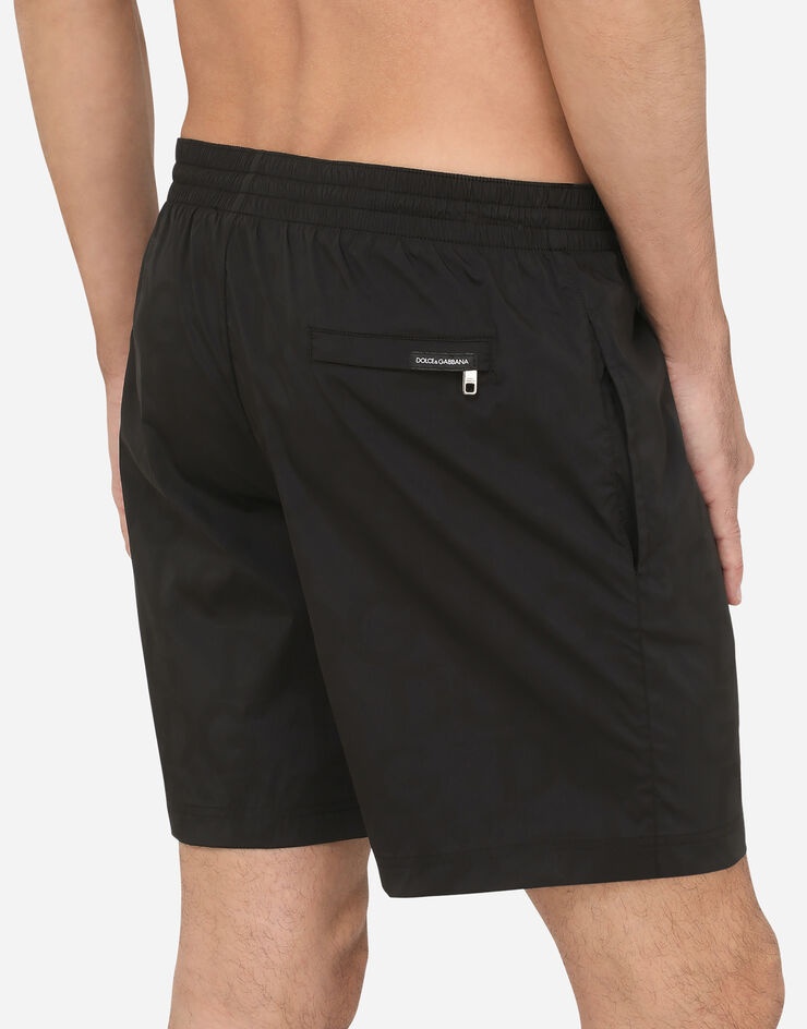 Mid-length swim trunks in hydro-sensitive fabric with logo print - 5