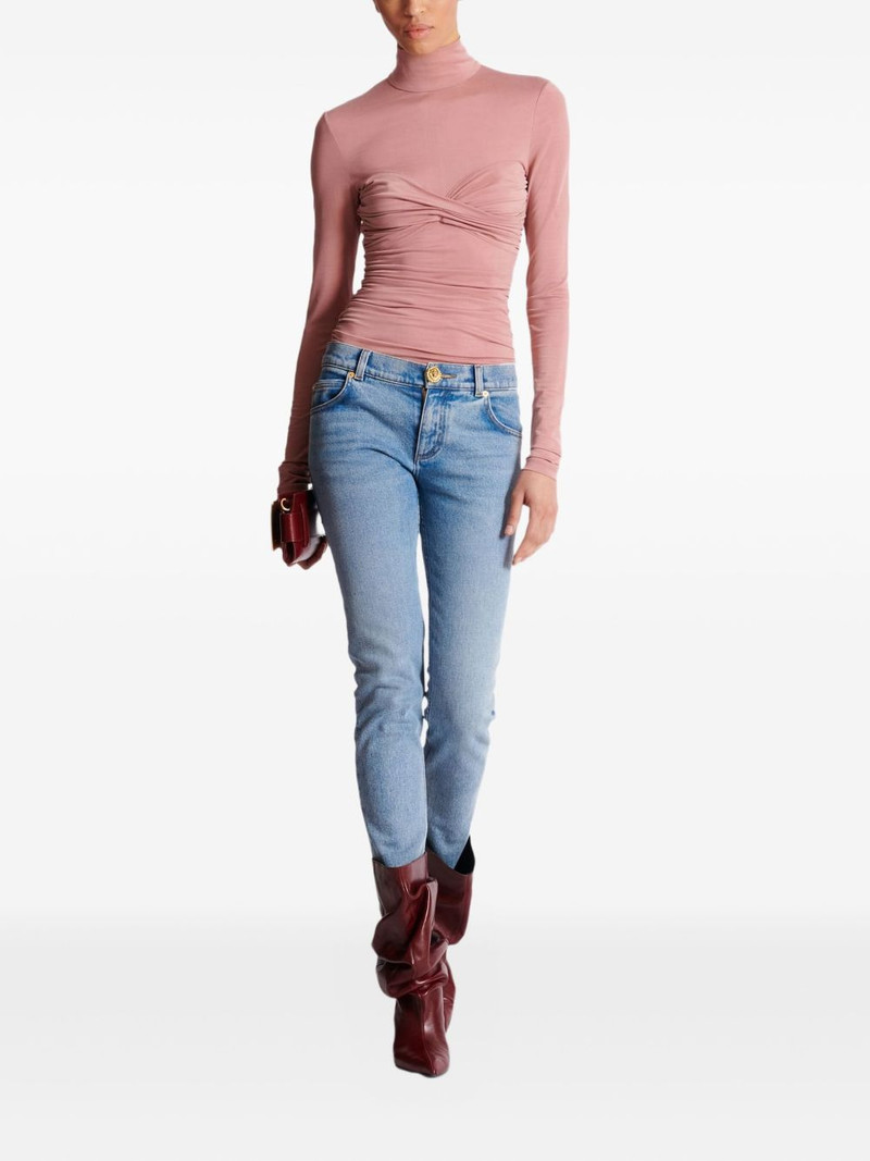 Balmain faded-wash button-embellished jeans outlook