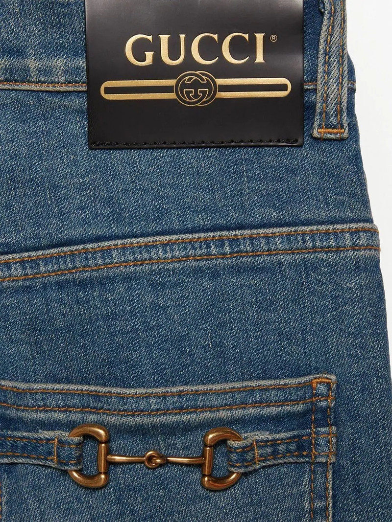 Horsebit-detail stonewashed skinny jeans 5