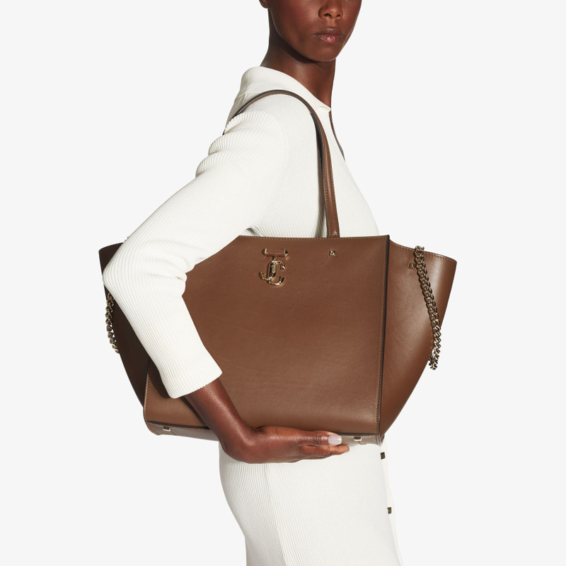 JIMMY CHOO Varenne Tote Bag
Dark Tan Fine Shiny Calf Leather Tote Bag with Light Gold JC Emblem outlook