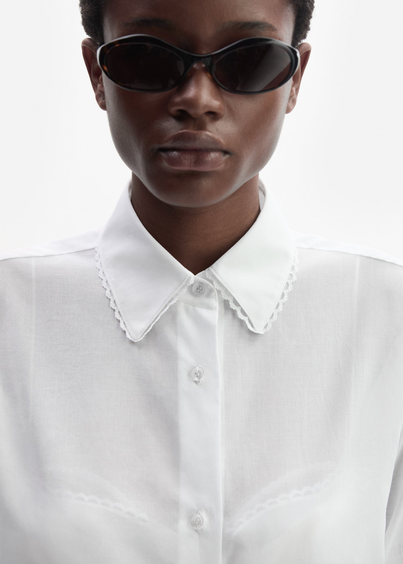 Embroidered sleeves lace-trimmed shirt in white 4