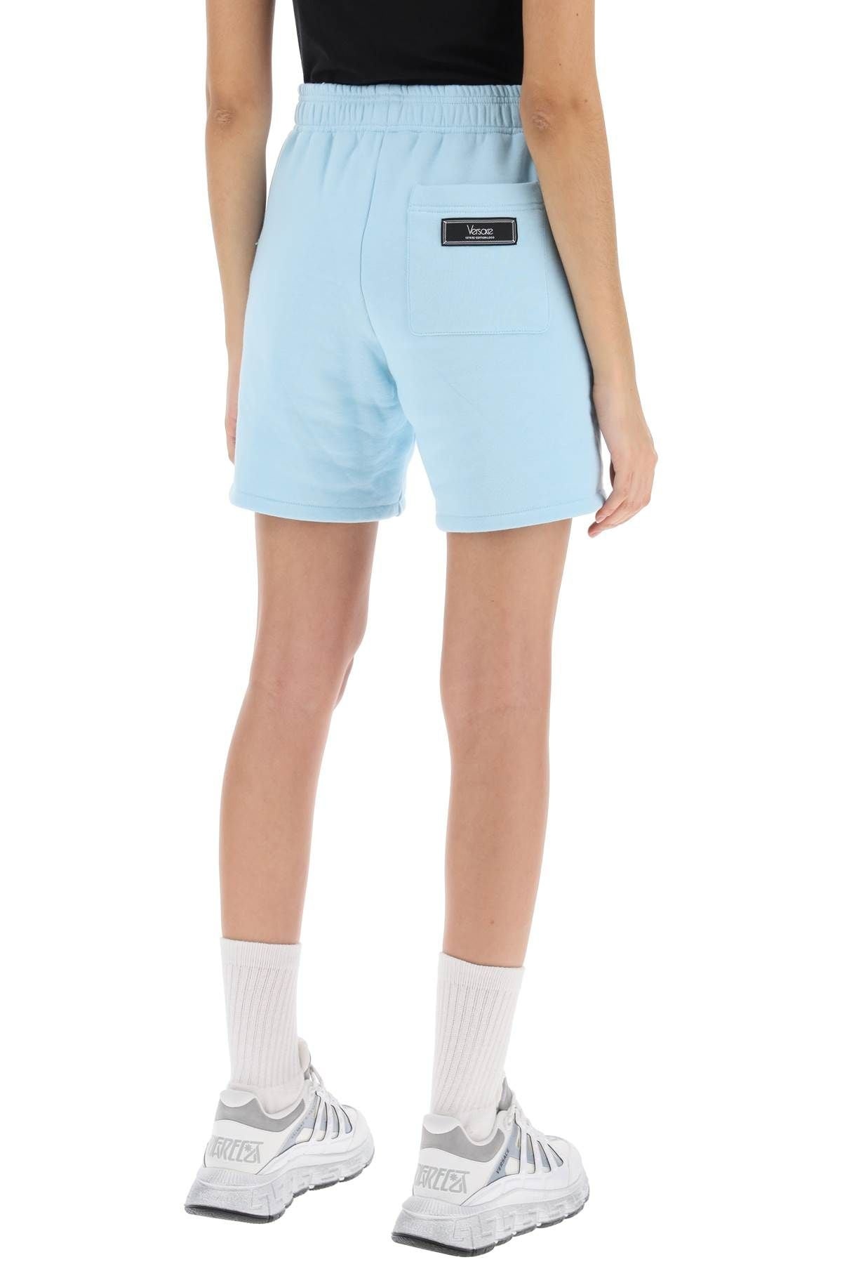 【送料&関税込】Versace Sweatshorts With 1978 Re-edition Log LIGHT BLUE VERSACE SWEATSHORTS WITH 1978 RE-EDITION LOGO
