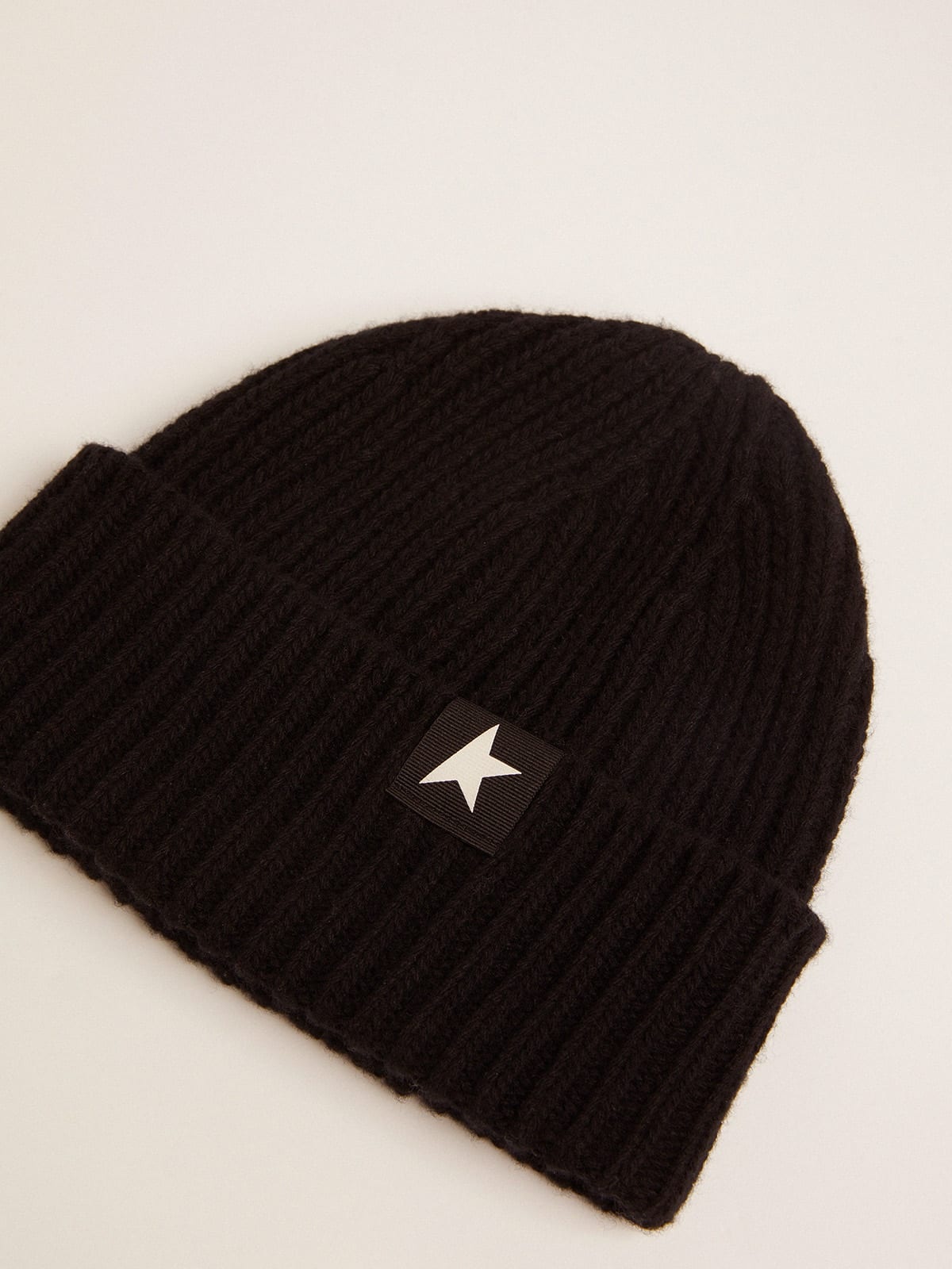 Black wool beanie with contrasting white star - 2
