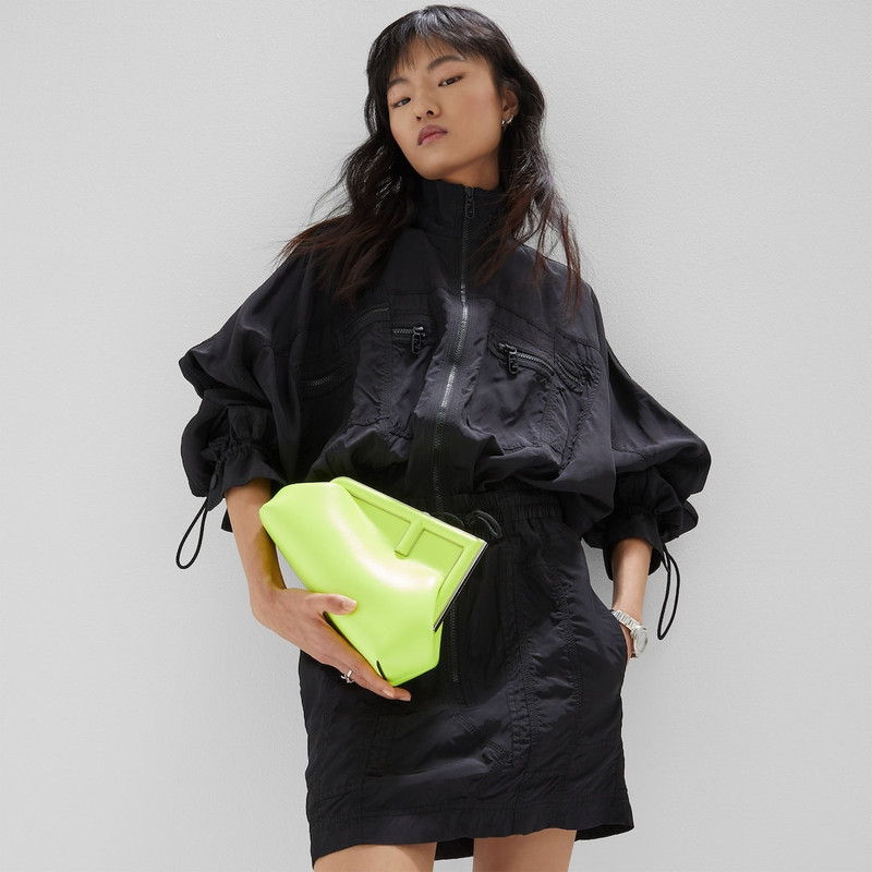 FENDI Small Fendi First bag made of soft, neon yellow nappa leather with oversized metal F clasp bound in  outlook