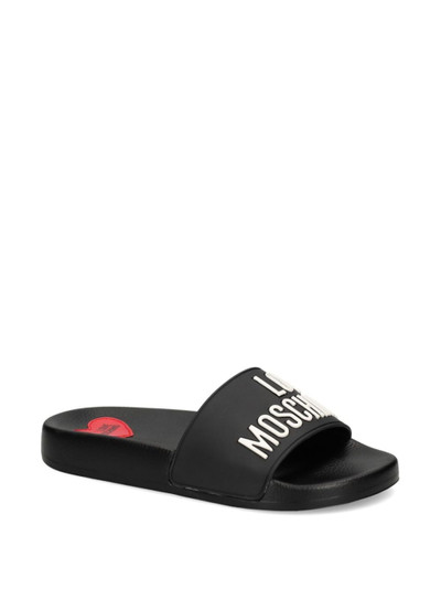 Moschino logo-embossed open-toe slides outlook
